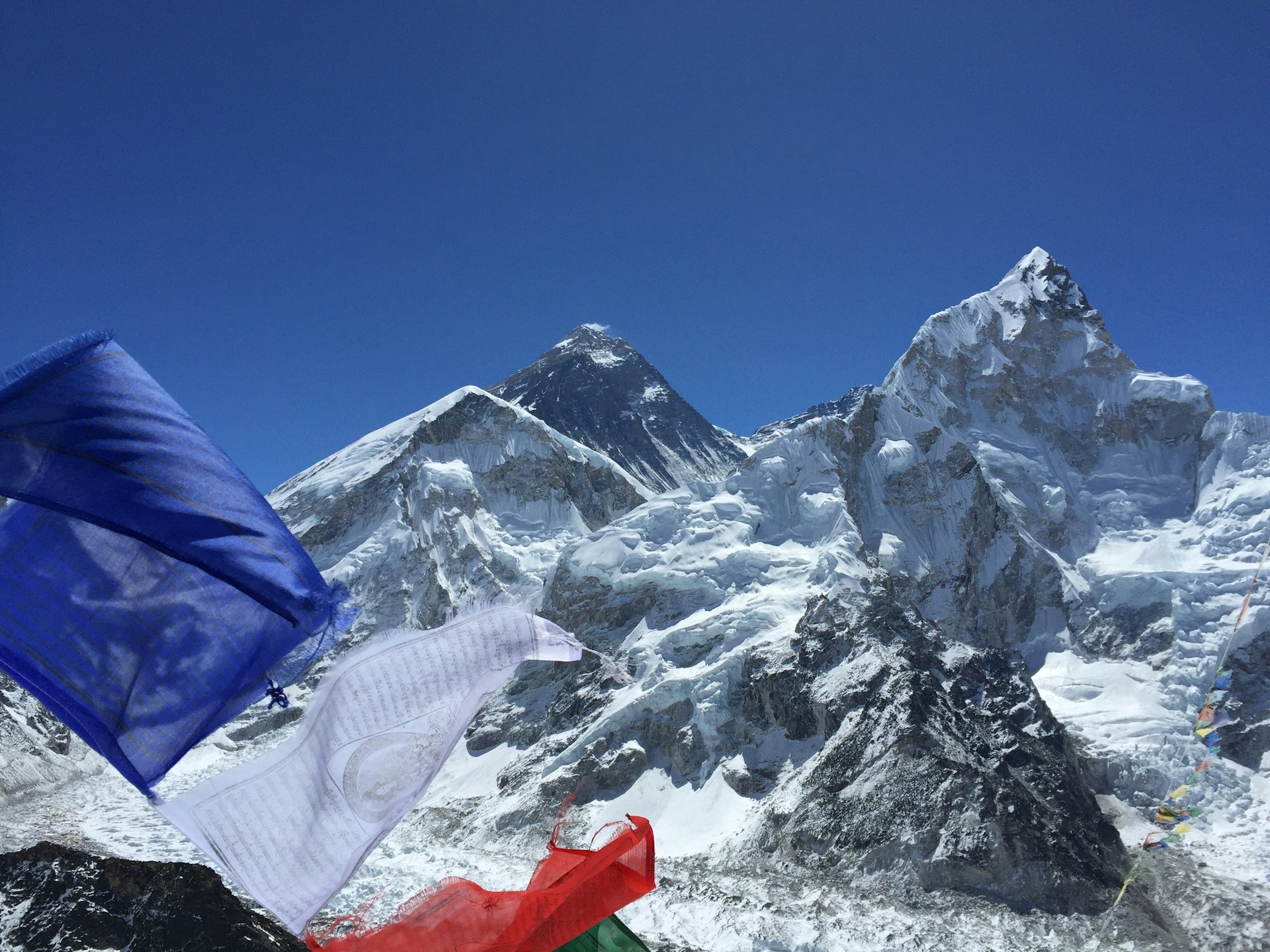 Majestic Everest View with Prayer Flags – A Spiritual Himalayan Experience