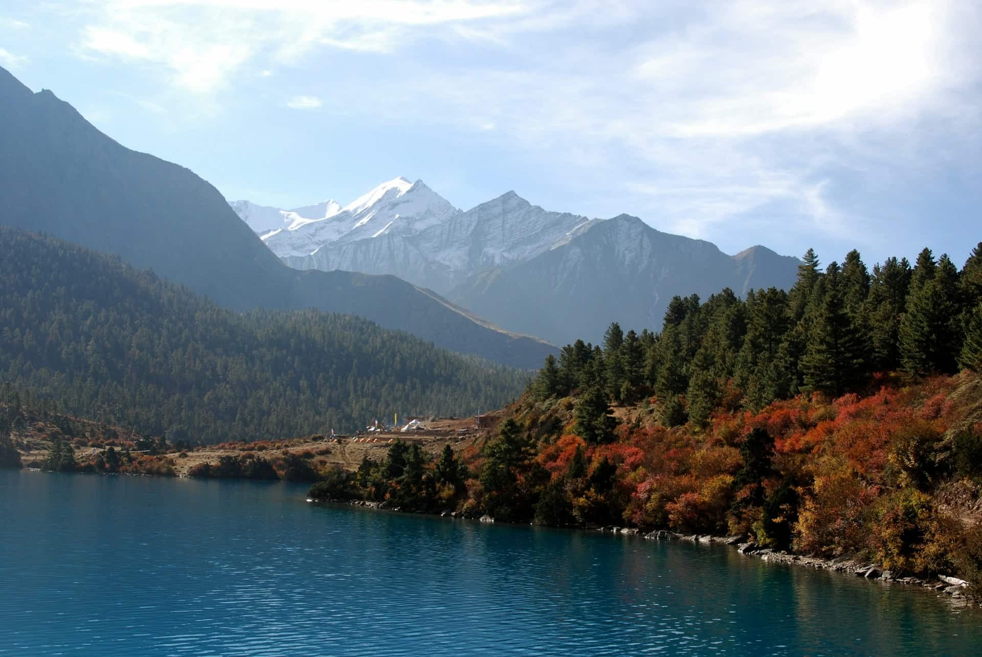 Shey Phoksundo Lake and the Flowing River Surrounded by Majestic Mountains